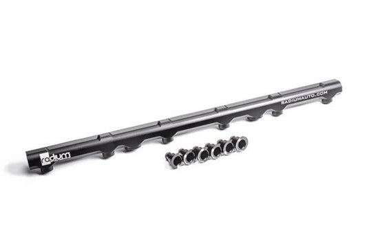 Radium Engineering high flow black anodized aluminum fuel rail for Toyota 2JZ-GE engine with 8AN ORB ports